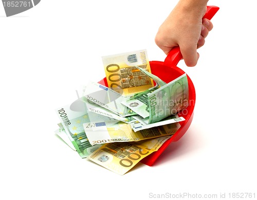 Image of hand, dustpan, money