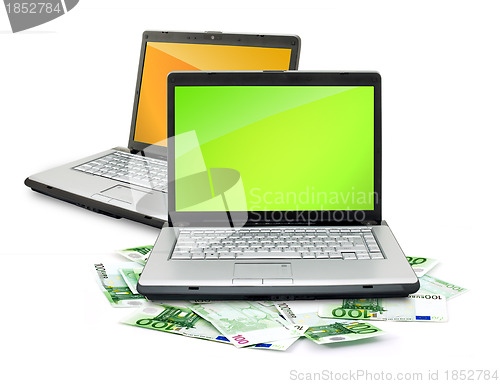 Image of Open laptop with money 