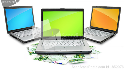 Image of Open laptop with money 