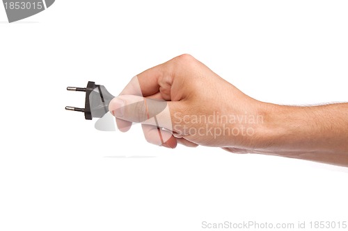 Image of Man is holding a black outlet in the hand