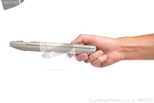 Image of A hand holding a remote control isolated