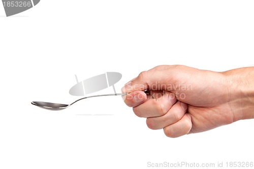 Image of Hand is holding a spoon isolated