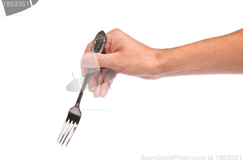 Image of Right mans hand with empty metallic fork