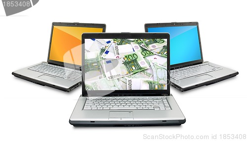 Image of Open laptops with money 