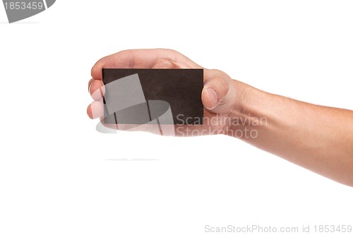 Image of Businessman's hand holding blank business card