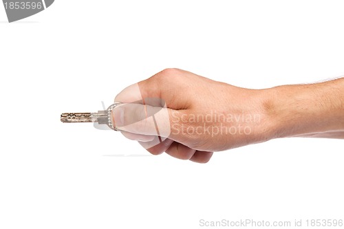 Image of Male hand holding a key to the house