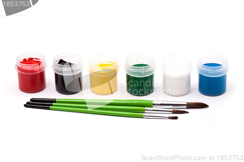 Image of Paints with paintbrushes