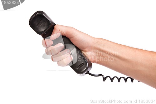 Image of Hand holding an old black telephone tube