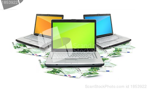 Image of Open laptop with money 