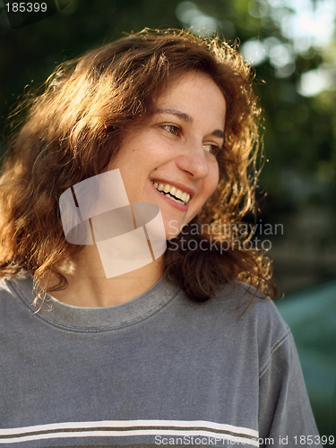 Image of Happy young woman outdoors