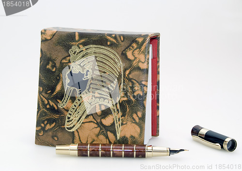 Image of Brown notebook and pen 