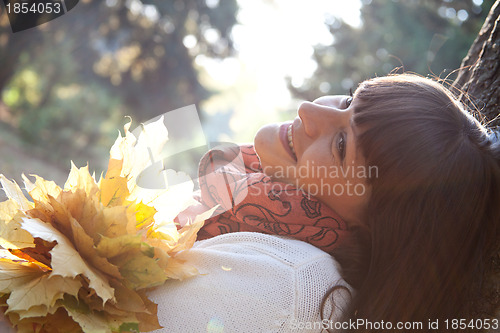 Image of  woman in the autumn park 