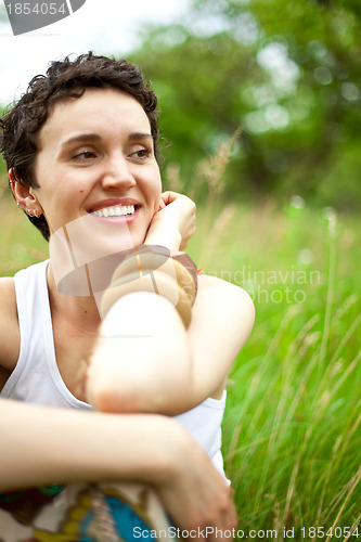 Image of girl resting on fresh spring grass 