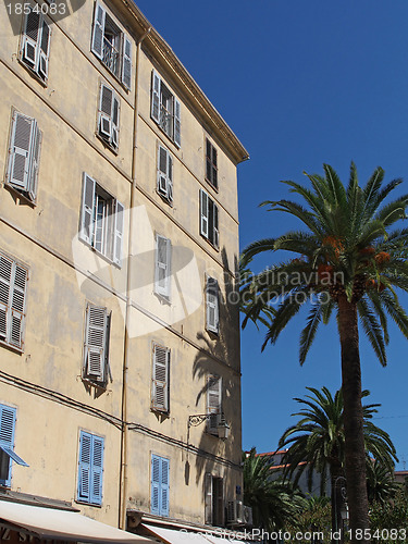 Image of Mediterranean building and palm trees , Ajaccio, Corsica.