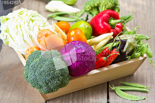 Image of Varieties of vegetables in wood tray