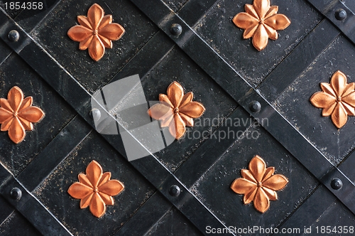 Image of Golden metal lattice on steel background