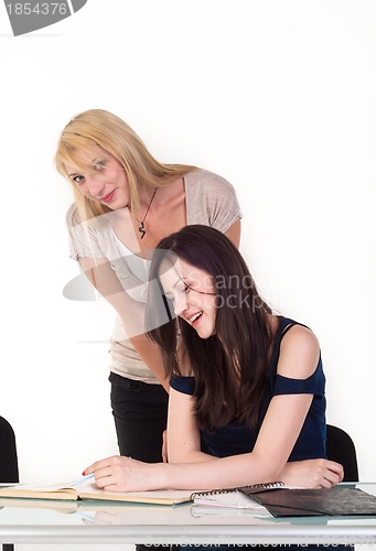 Image of Two beautiful student girls getting ready for school