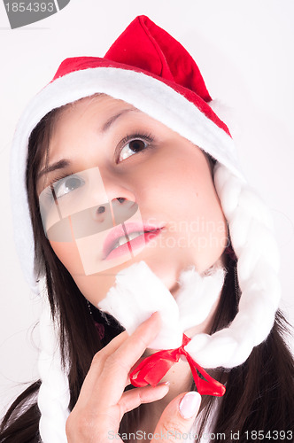 Image of Young woman with christmas present