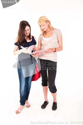 Image of Two beautiful student girls getting ready for school