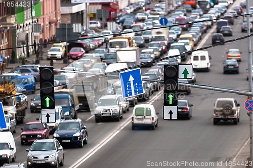 Image of Green traffic lamps and blue sign