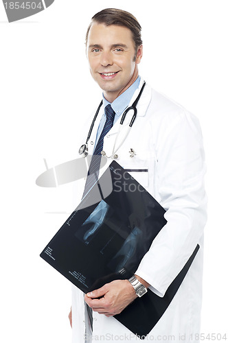 Image of Smart surgeon holding x-ray report of a patient