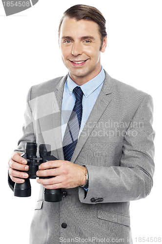 Image of Smiling male consultant holding binoculars