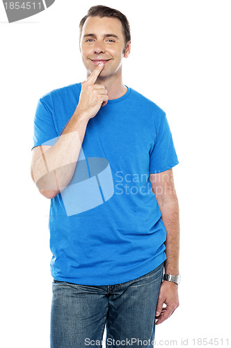 Image of Young guy blushing, posing in casuals