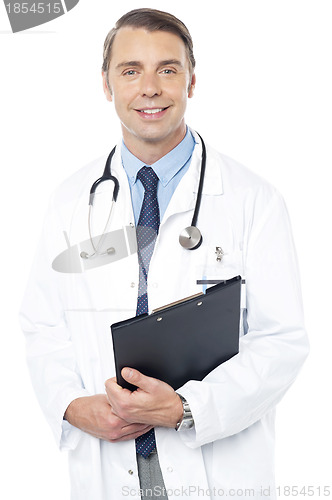 Image of Smiling professional physician carrying clipboard