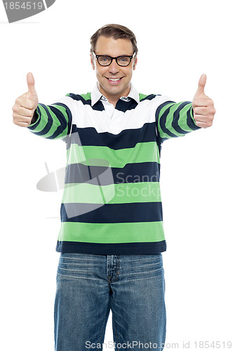 Image of Cool guy showing double thumbs up to camera