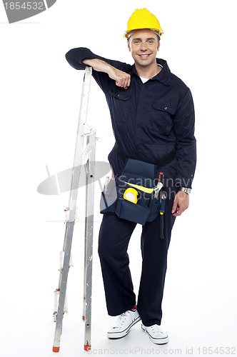 Image of Industrial engineer resting his hands on stepladder
