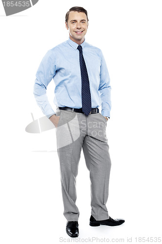 Image of Relaxed young manager posing in style
