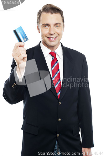 Image of An entrepreneur showing debit card to camera