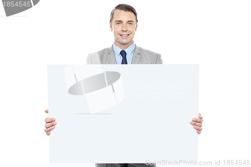Image of Business representative holding white billboard