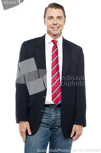 Image of Smiling young businessperson posing casually