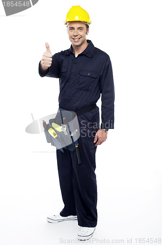 Image of Industrial contractor gesturing thumbs up