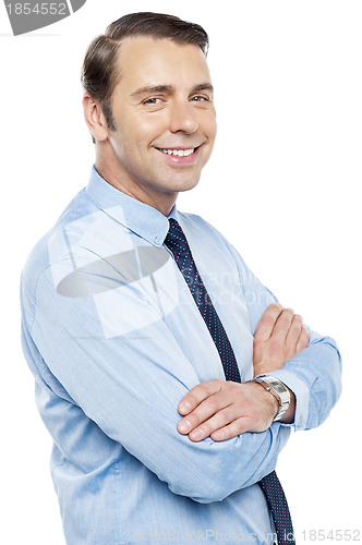 Image of Handsome representative posing with folded arms