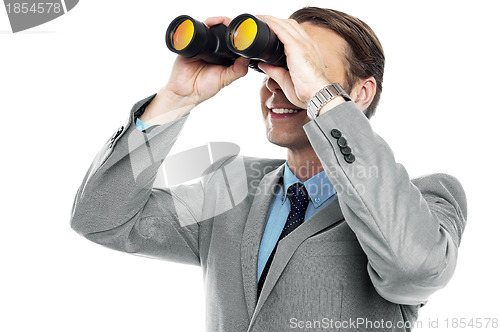 Image of Businessman viewing through binoculars