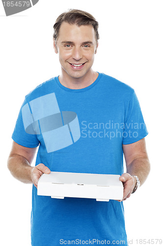 Image of Hungry man holding pizza box
