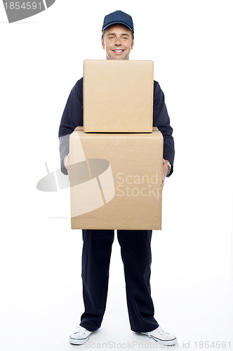 Image of Young relocation staff member holding cardboard boxes
