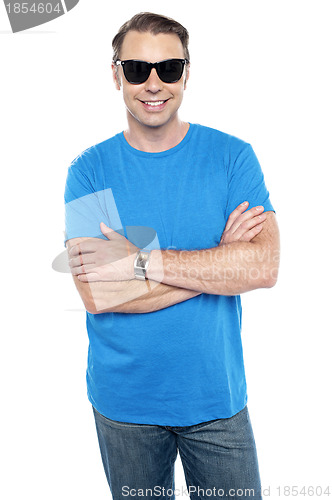 Image of Cool dude wearing goggles, posing with arms crossed