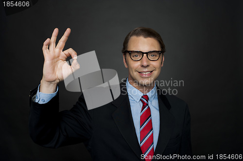 Image of Manager showing okay sign to camera, good work
