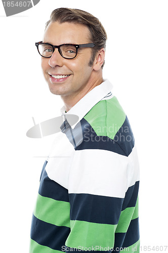 Image of Fashionable young man posing. Half length portrait
