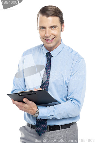 Image of Smiling male secretary holding a clipboard