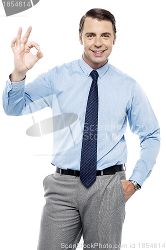 Image of Team leader gesturing okay sign to his subordinates