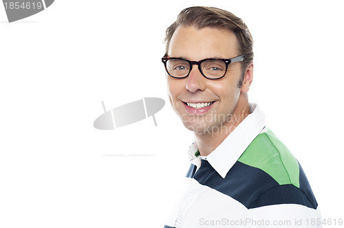 Image of Cheerful young casual guy looking at you