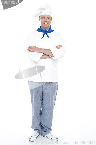 Image of Young chef posing with his arms crossed