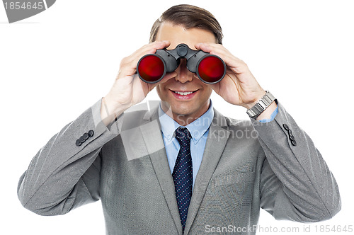 Image of Young officer looking through binoculars