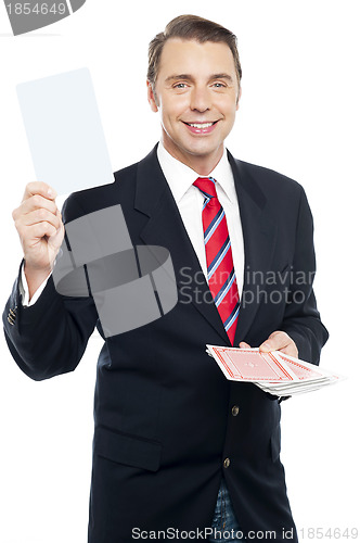 Image of Executive showing blank playing card to camera