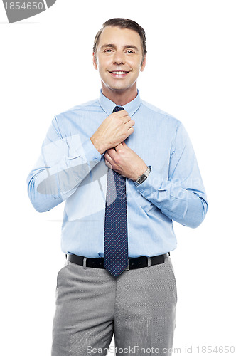 Image of Sales representative adjusting his tie before the meeting