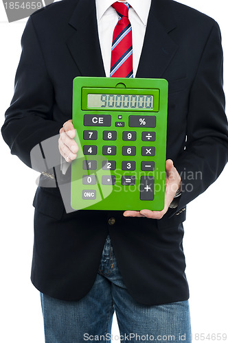 Image of Cropped image of business guy holding calculator
